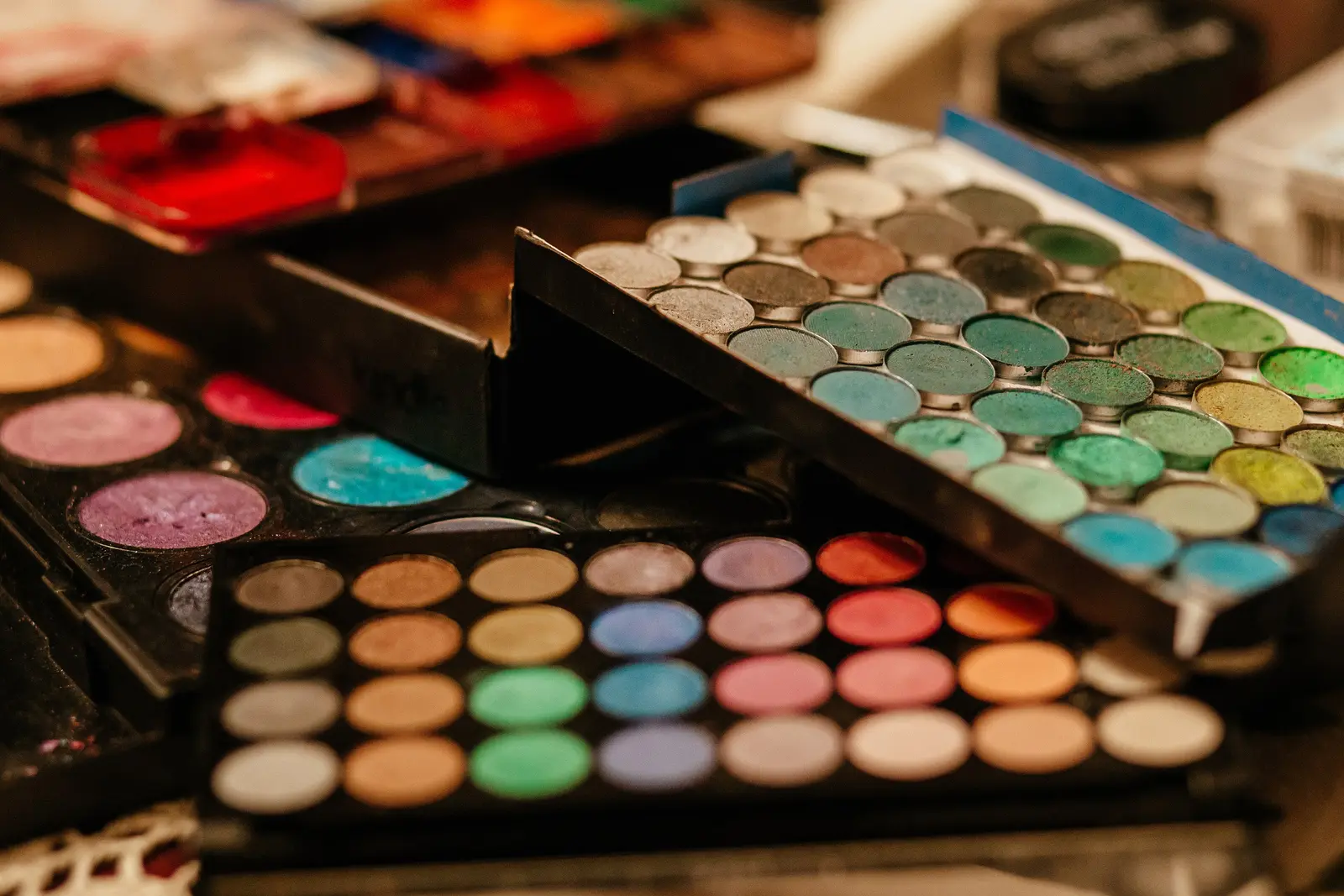 Open eyeshadow compacts in bright colors