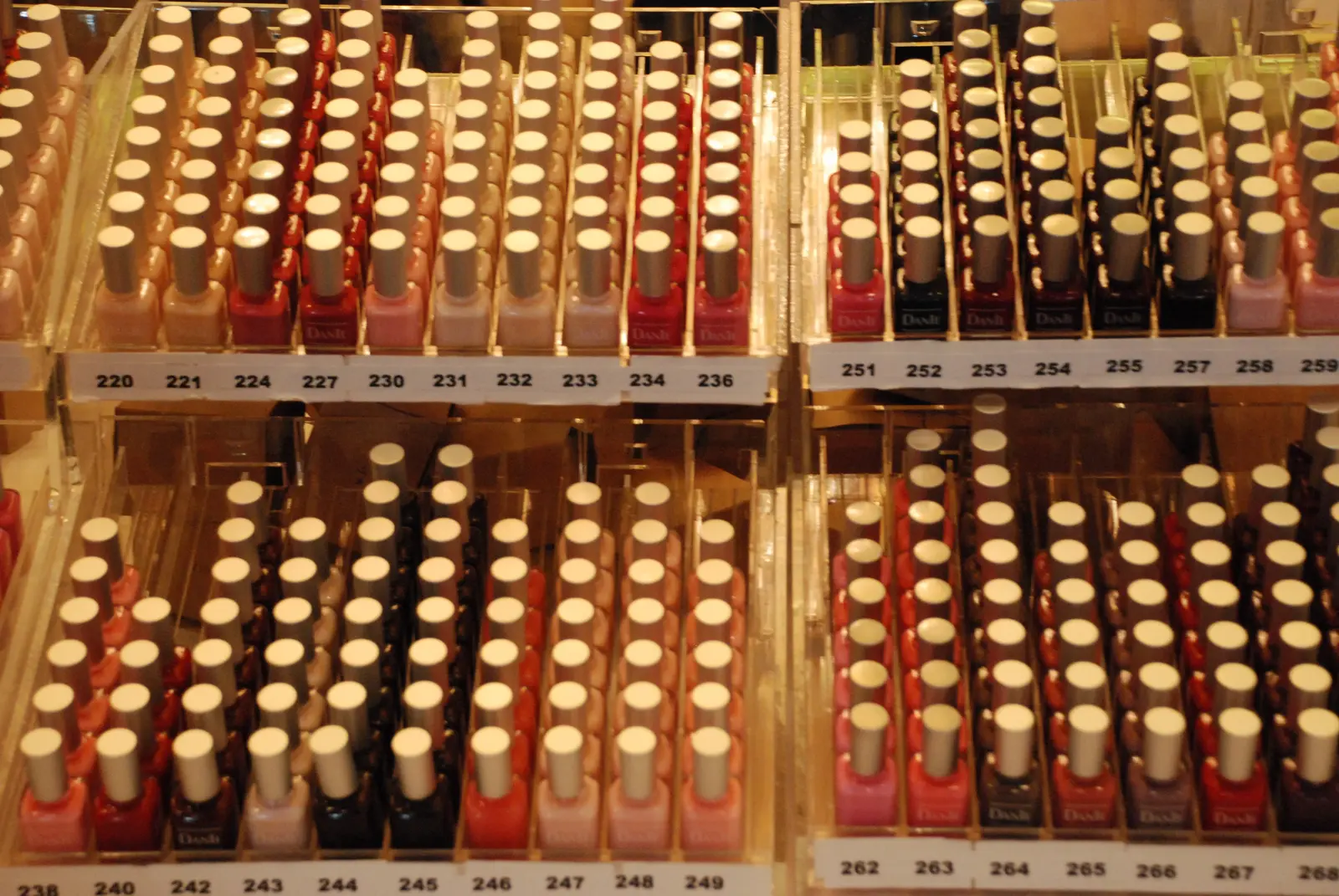 Grid of nail polish bottles in many shades